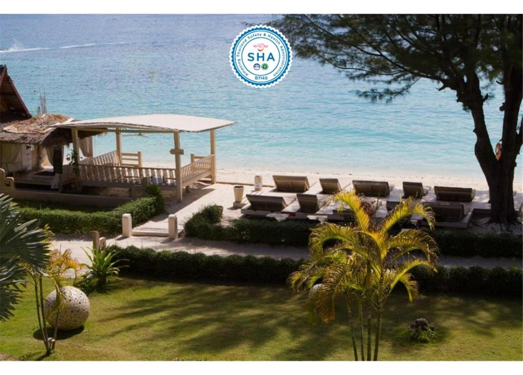 a view of the beach with a gazebo and the ocean at Mama Beach Residence- SHA Certified in Phi Phi Islands