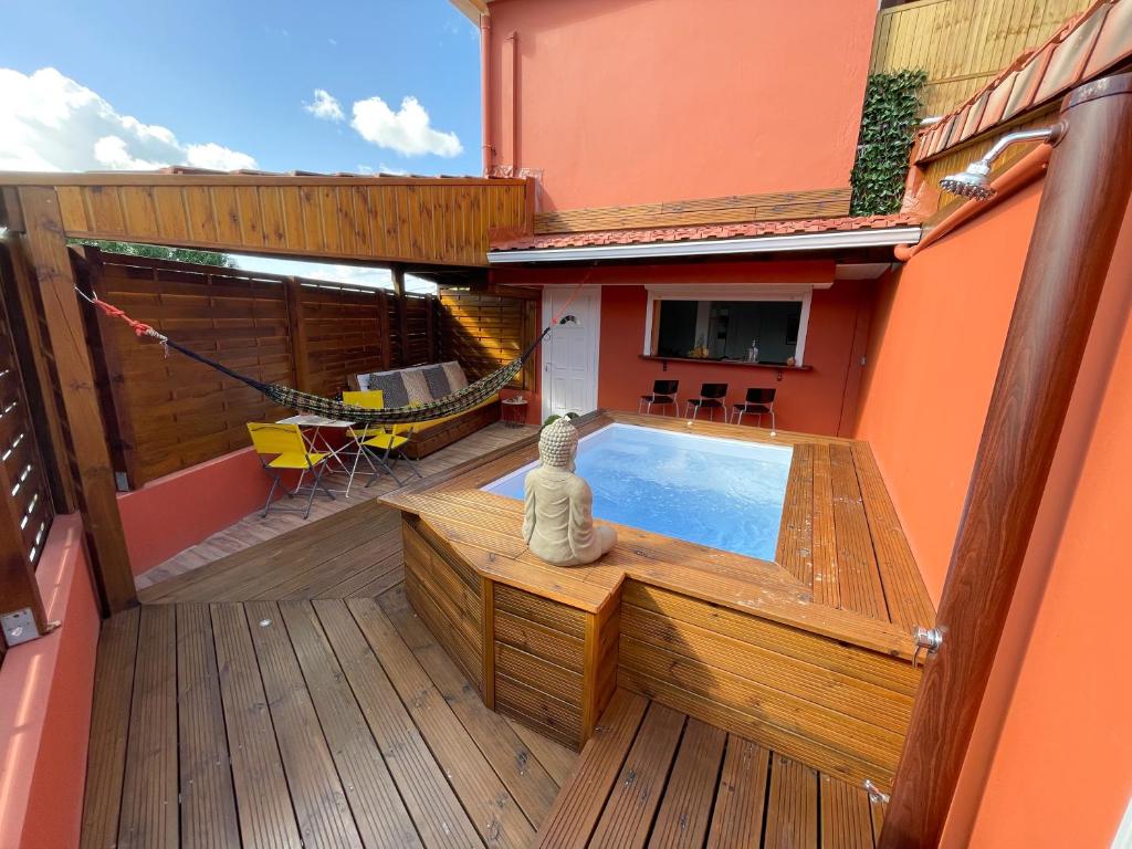 a balcony with a hot tub on a house at Chez Rey in Médecin