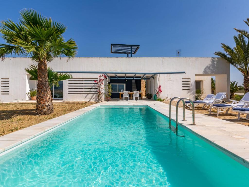 a swimming pool in front of a house at Holiday Home Finca La Veleta by Interhome in Los Gallardos