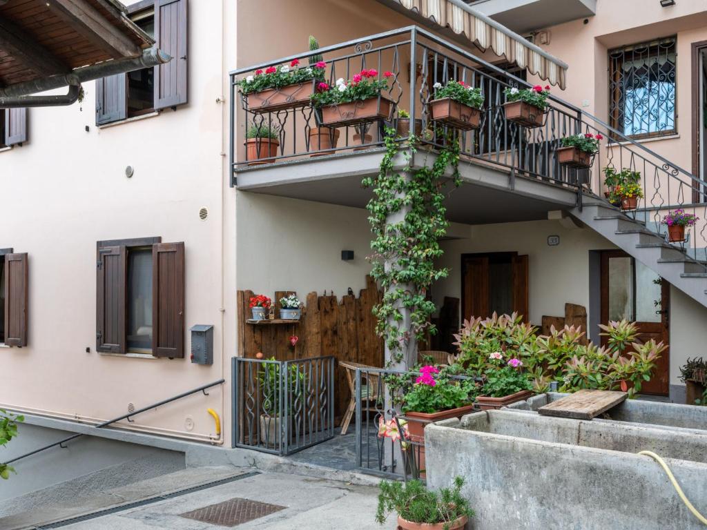 an apartment building with potted plants on the balconies at Apartment Cima by Interhome in Aosta