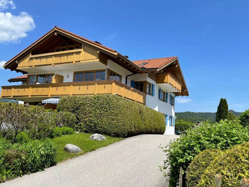 a house on top of a hill with a driveway at Apartment Flösserstrasse by Interhome in Wallgau