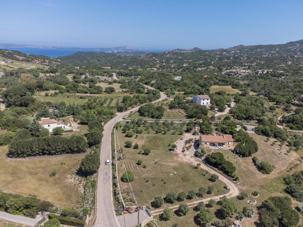 an aerial view of a road with houses and trees at Holiday Home Nanai by Interhome in Cannigione