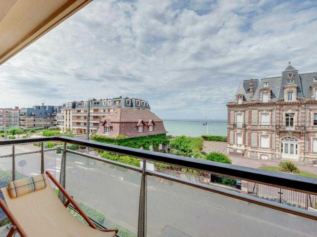 an apartment balcony with a view of a building at Apartment Prince Albert by Interhome in Cabourg