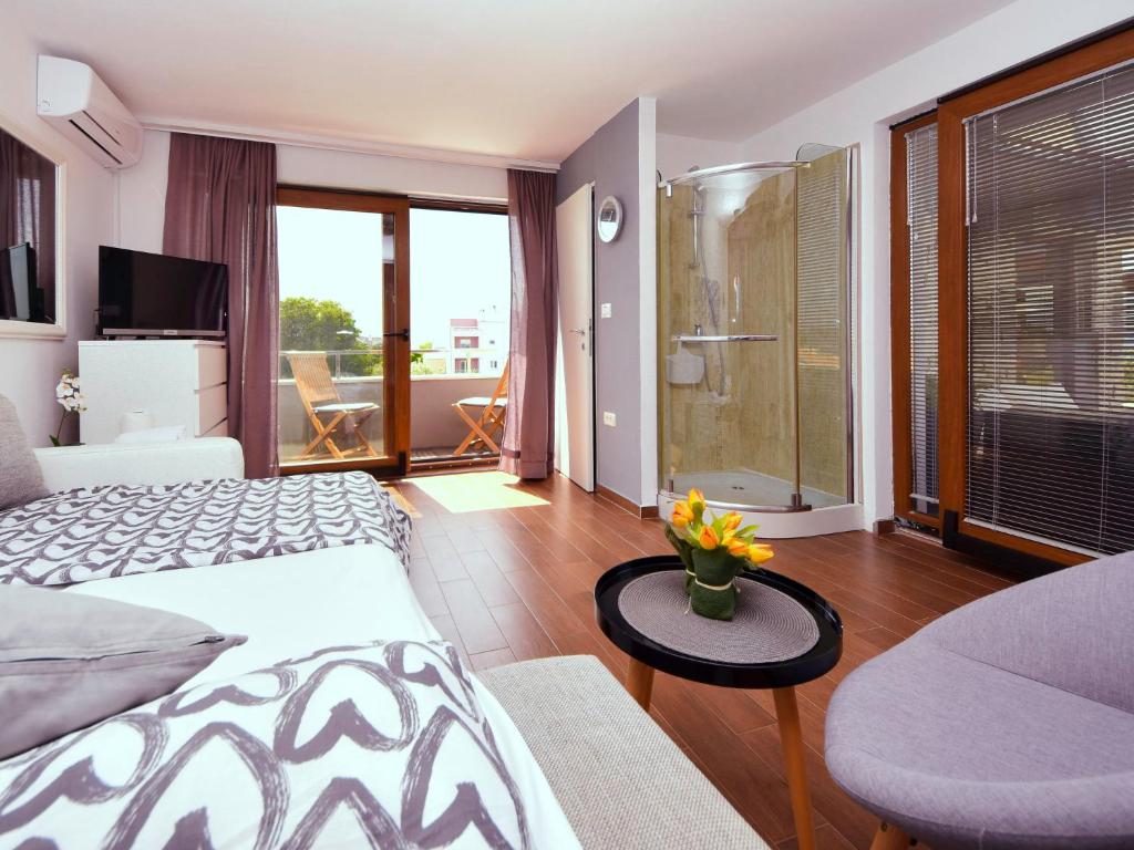 Posteľ alebo postele v izbe v ubytovaní Holiday Home Arbo by Interhome