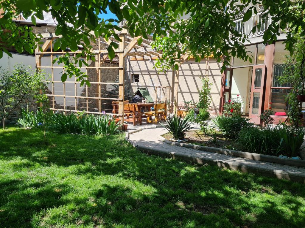 a garden in front of a house at Southside Bed and Breakfast in Bishkek