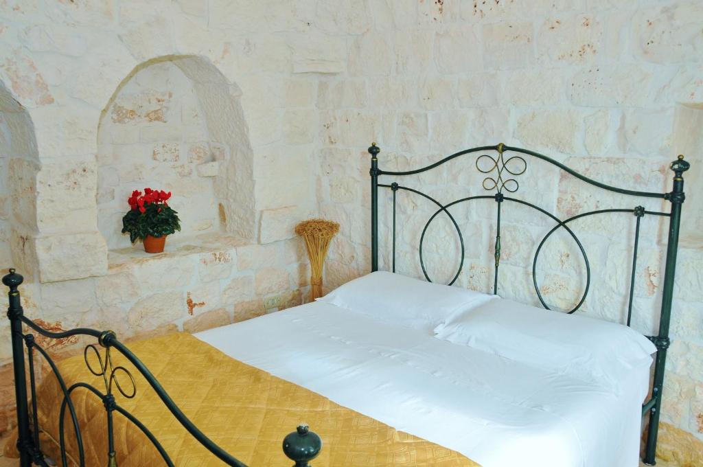 Postel nebo postele na pokoji v ubytování Trulli Vulés