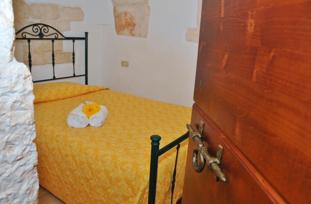 Postel nebo postele na pokoji v ubytování Trulli Vulés