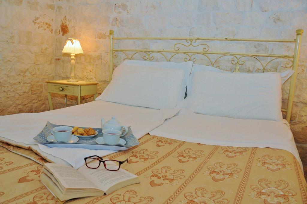 Postel nebo postele na pokoji v ubytování Trulli Vulés