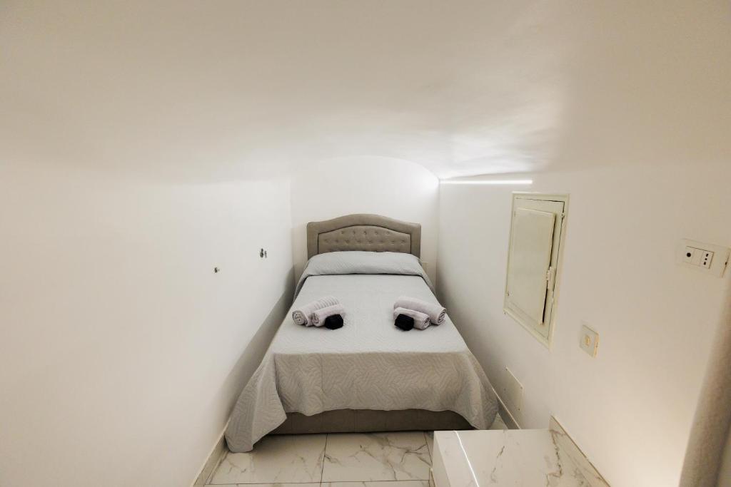 A bed or beds in a room at Scudaniglio Home