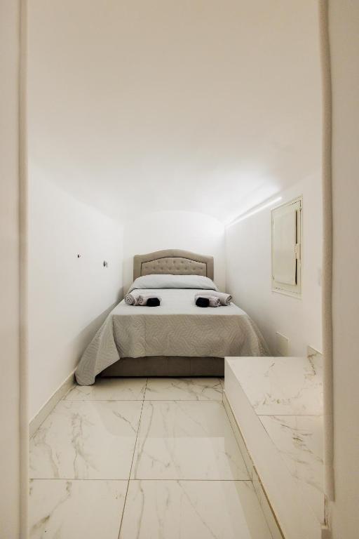 A bed or beds in a room at Scudaniglio Home