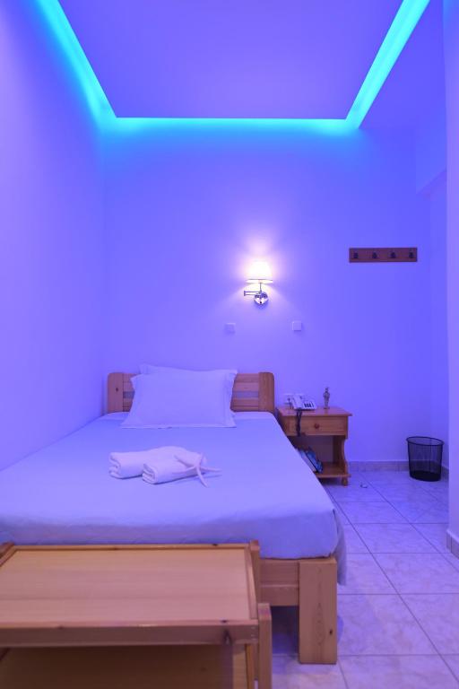 Postel nebo postele na pokoji v ubytování Hotel Zeus