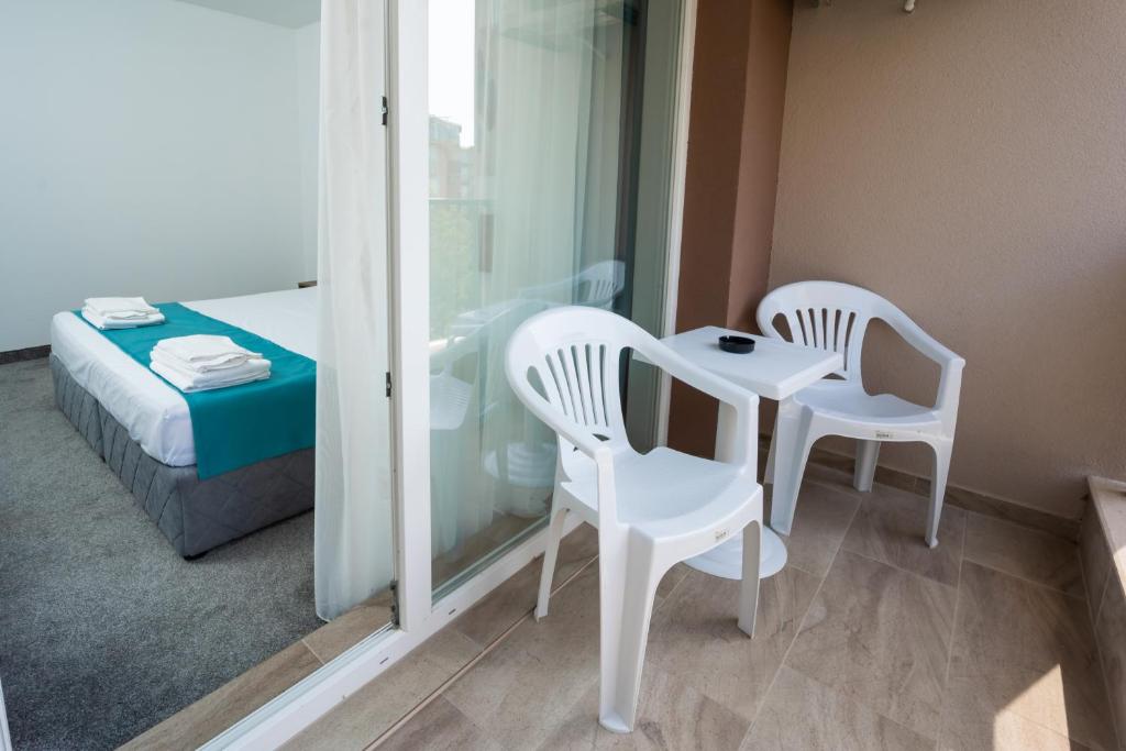 A bed or beds in a room at Hotel Zonya