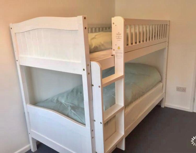 two bunk beds in a small room at Great price, lovely comfy flat.2 mins from the sea in Lyme Regis
