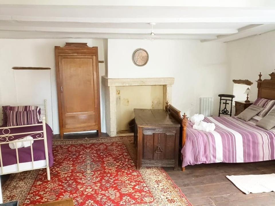 Postel nebo postele na pokoji v ubytování The Nook - charme médiéval, confort moderne
