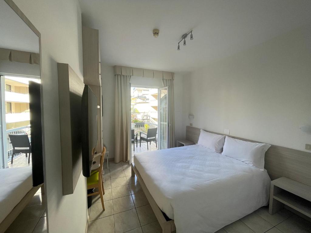 Postel nebo postele na pokoji v ubytování Hotel Athena