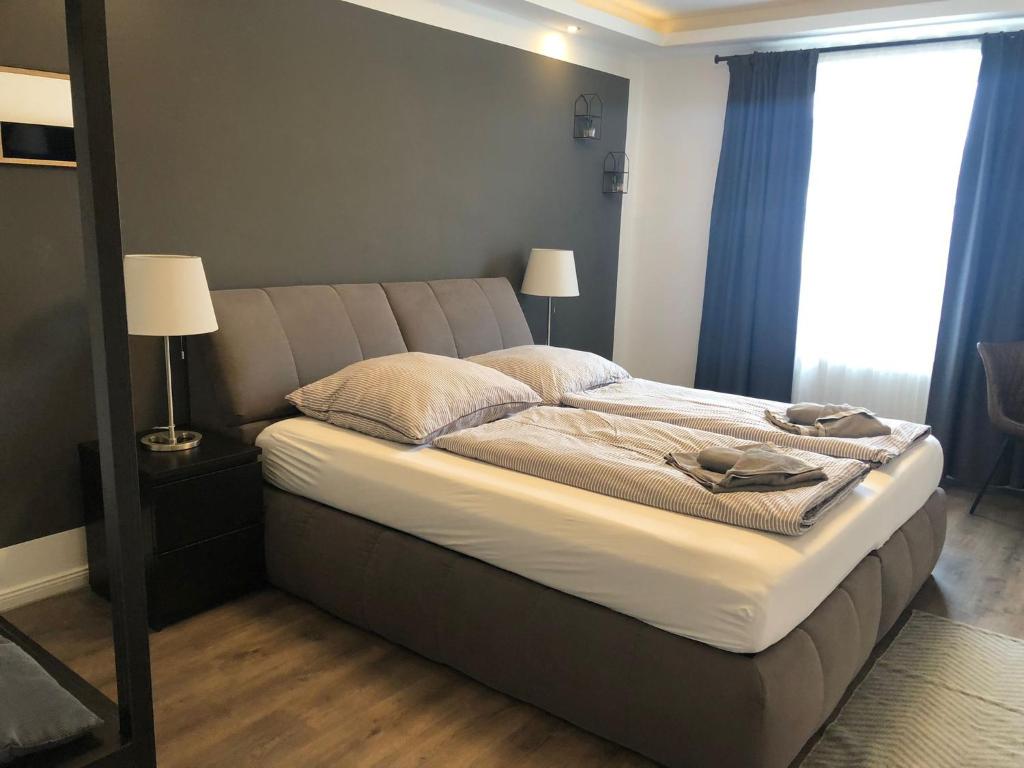 Säng eller sängar i ett rum på Apartment One Bremerhaven