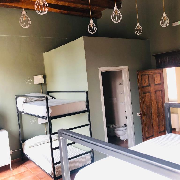 Postel nebo postele na pokoji v ubytování Casa Conte Rosso