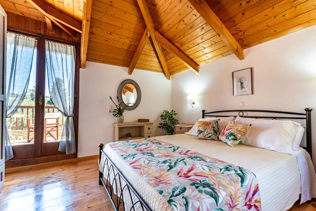 Postel nebo postele na pokoji v ubytování Casa Koukounaria