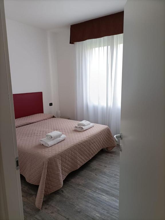 Postelja oz. postelje v sobi nastanitve Affitta Camere Elena