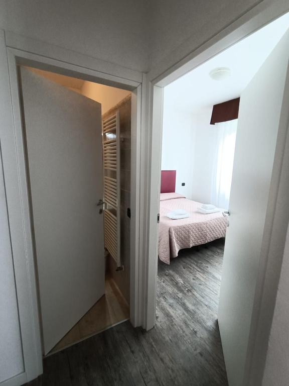 Postelja oz. postelje v sobi nastanitve Affitta Camere Elena