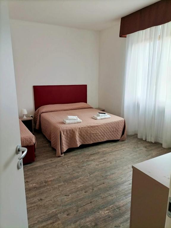 Postelja oz. postelje v sobi nastanitve Affitta Camere Elena