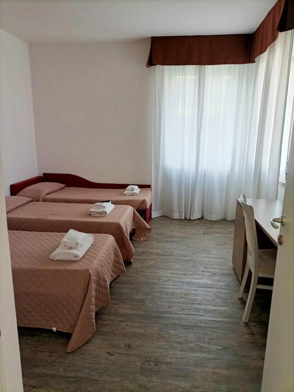 Postelja oz. postelje v sobi nastanitve Affitta Camere Elena