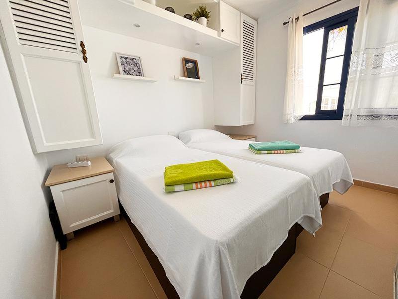 A bed or beds in a room at NEW Atalaya - Amazing Sea Views&Fantastic Pool