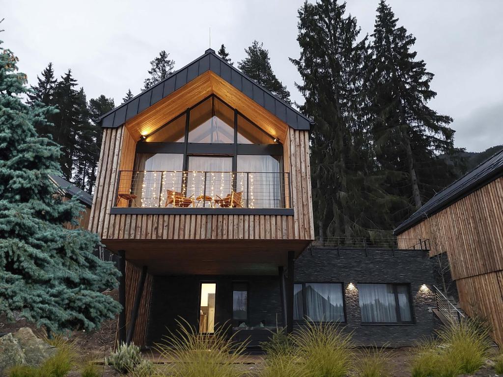 a house with a large window on the side of it at Wellness chalet Vénus in Liptovský Mikuláš