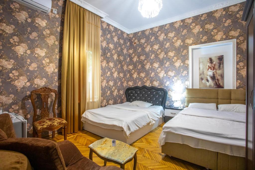 Postel nebo postele na pokoji v ubytování HOTEl MKUDRO