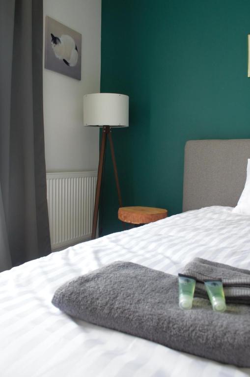 Posteľ alebo postele v izbe v ubytovaní Lighter Apartment