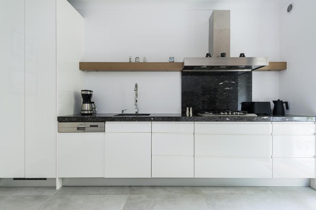Kuchyňa alebo kuchynka v ubytovaní Syncret Apartment - LoftAffair