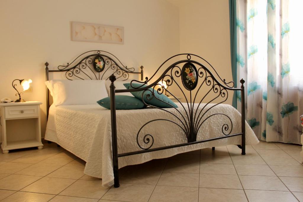 Posteľ alebo postele v izbe v ubytovaní Desy Appartamenti