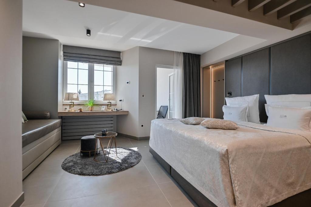 Postel nebo postele na pokoji v ubytování Hotel Malin