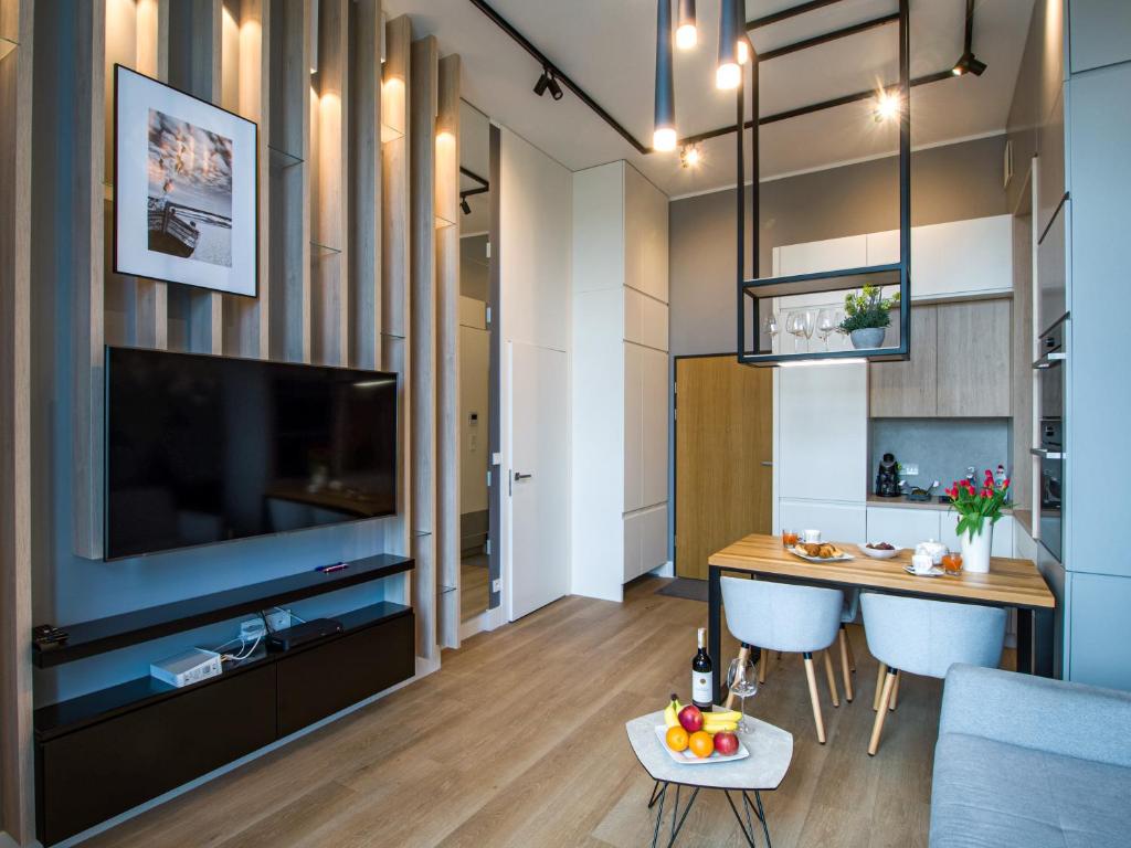 Televízia a/alebo spoločenská miestnosť v ubytovaní Seaside loft