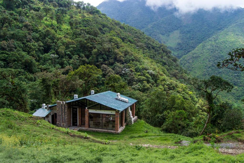 a house on the side of a mountain at Neblina Bird in Otavalo