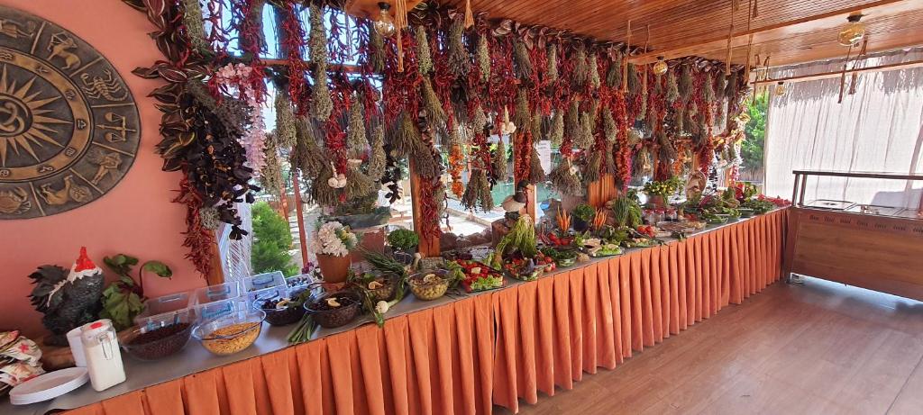 a display of plants on a table in a room at Grand Yayla Hotel in Çeşme