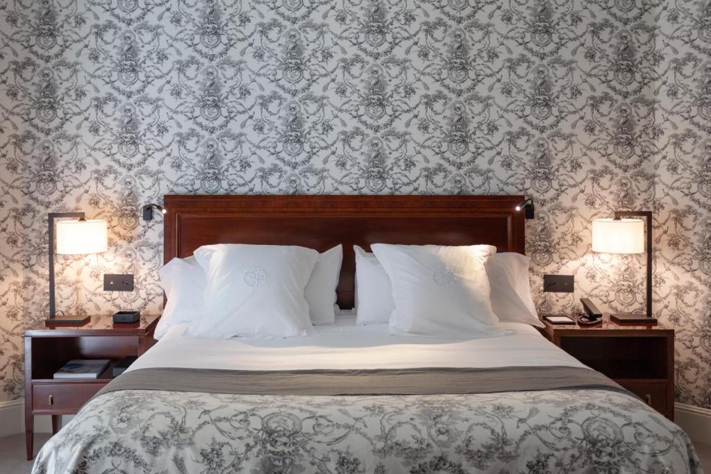 Postel nebo postele na pokoji v ubytování Hotel Villa Soro