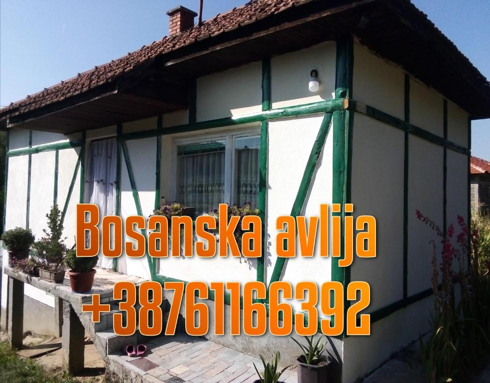 a house with a sign in front of it at Kuća na selu-Mutvak- in Visoko