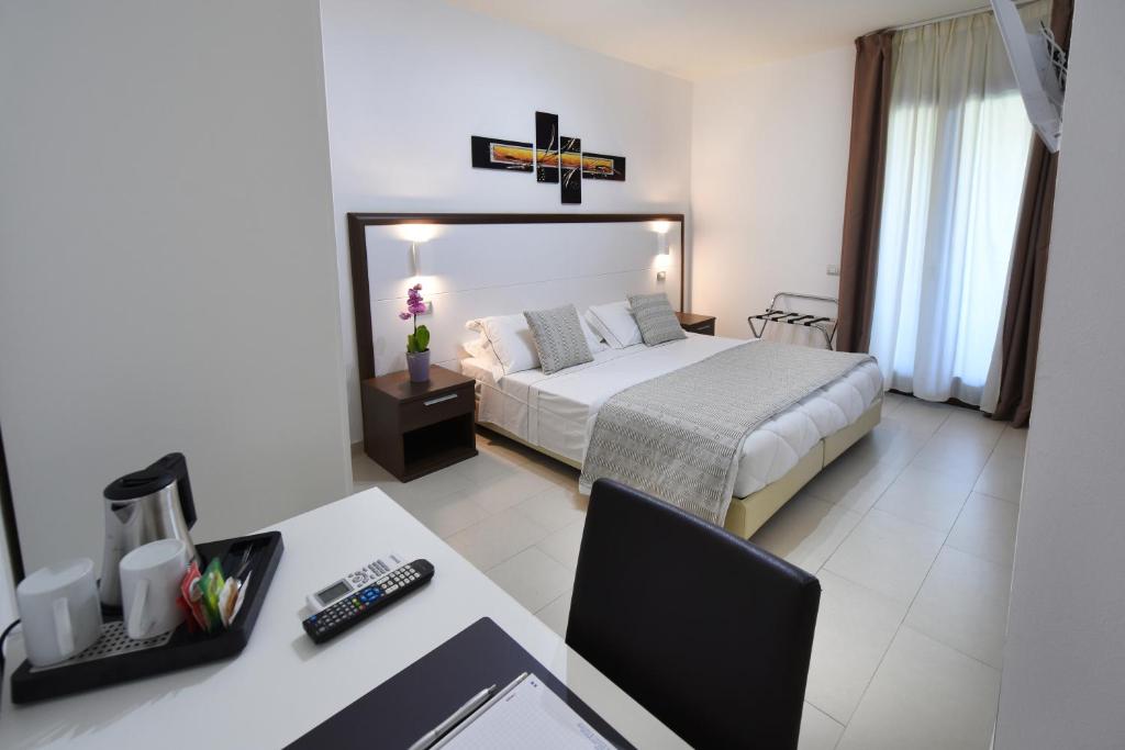 Postel nebo postele na pokoji v ubytování Xenia Hotel