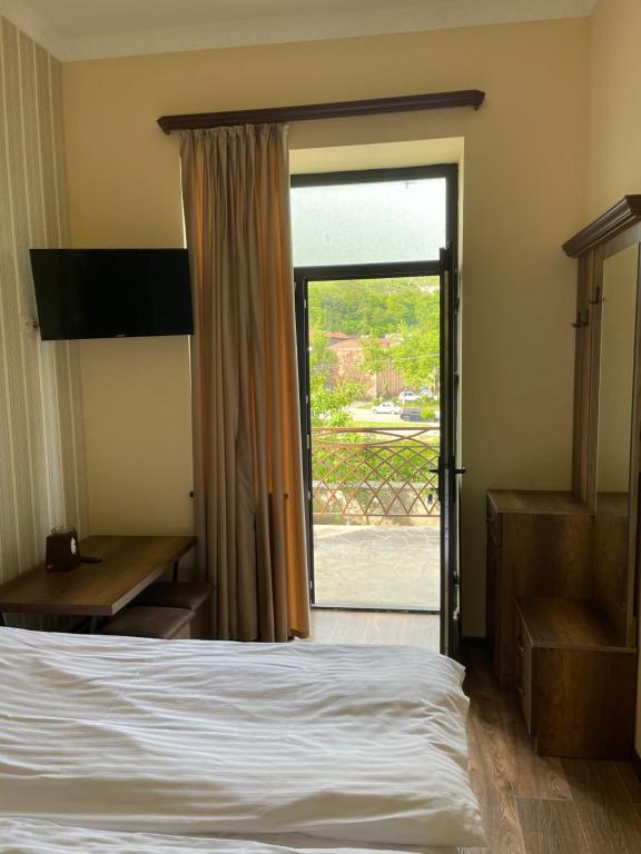 Postel nebo postele na pokoji v ubytování Yolyans Hotel