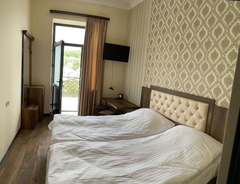 Postel nebo postele na pokoji v ubytování Yolyans Hotel
