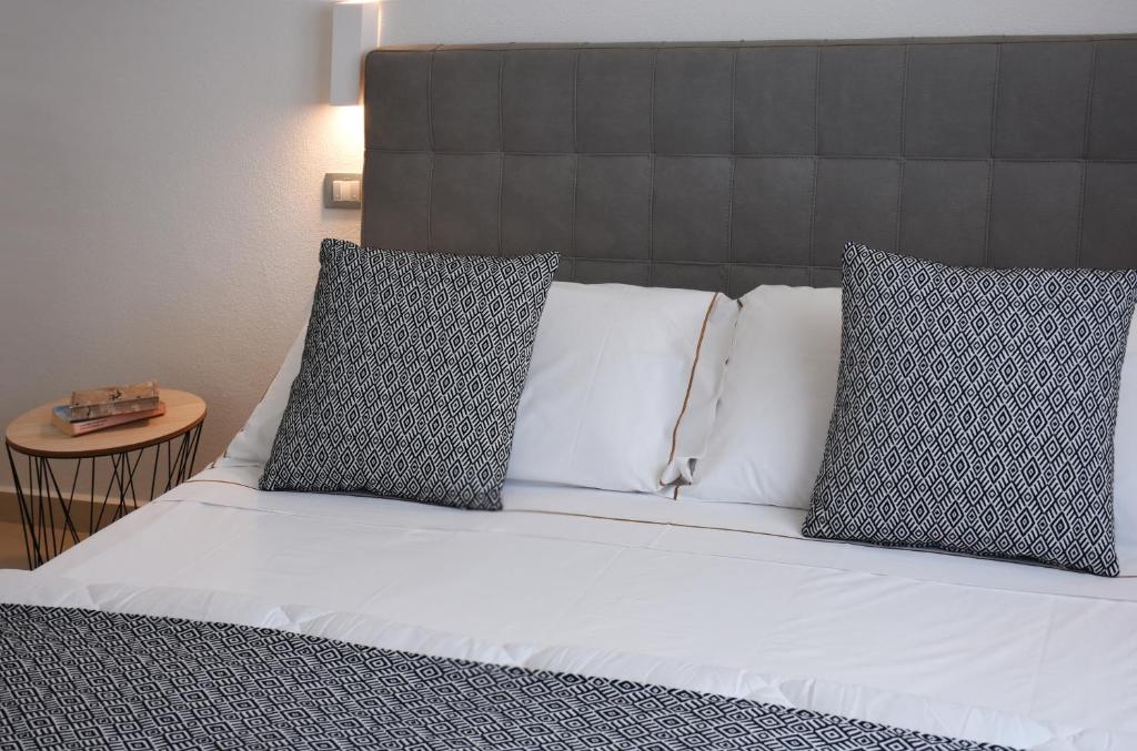 Postel nebo postele na pokoji v ubytování Xenia Hotel
