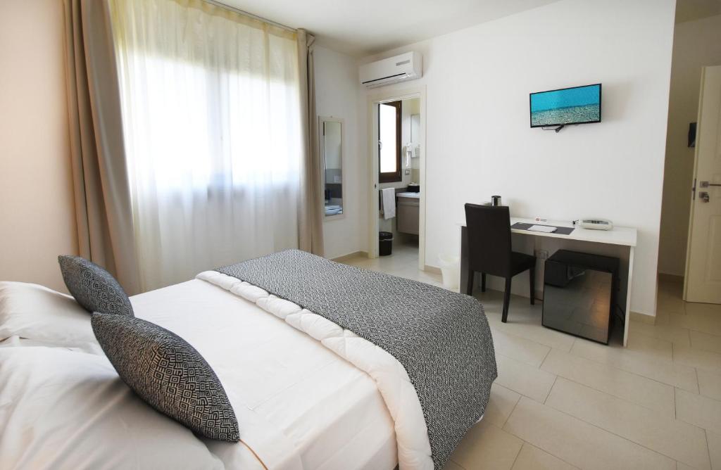 Postel nebo postele na pokoji v ubytování Xenia Hotel