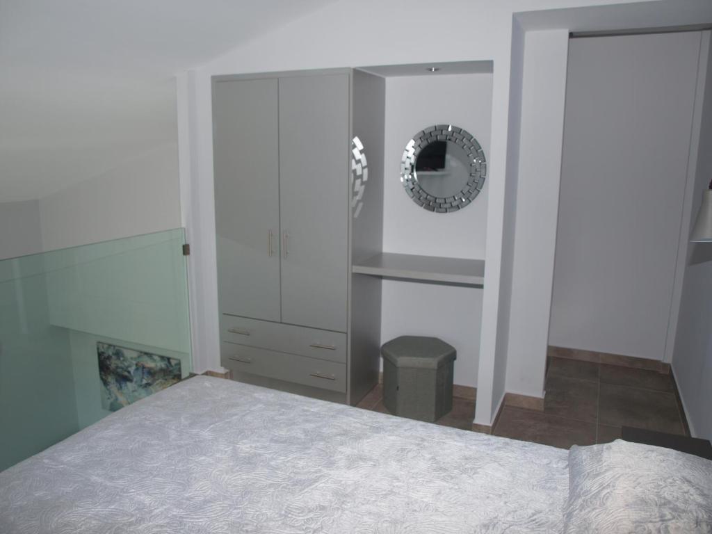 Posteľ alebo postele v izbe v ubytovaní Attic Apartments