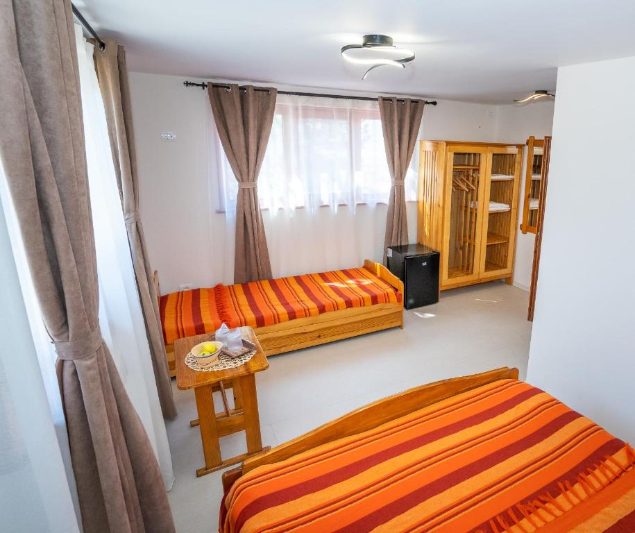 Postel nebo postele na pokoji v ubytování Casa Nikita