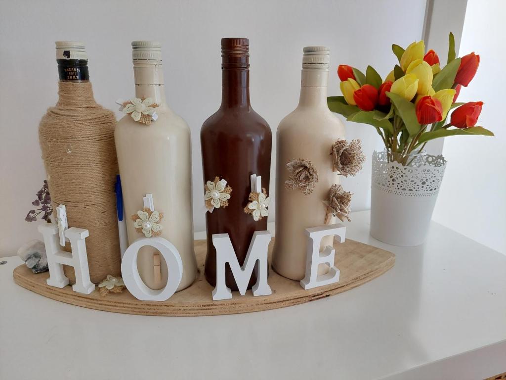 a shelf with bottles and a sign that says mum at Alloggio Ugo Foscolo in Monopoli