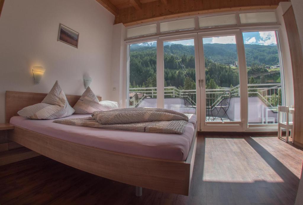 Posteľ alebo postele v izbe v ubytovaní Alpenapart Saphir