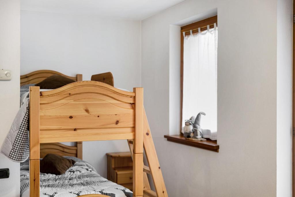 Postel nebo postele na pokoji v ubytování Baita Bruno 6