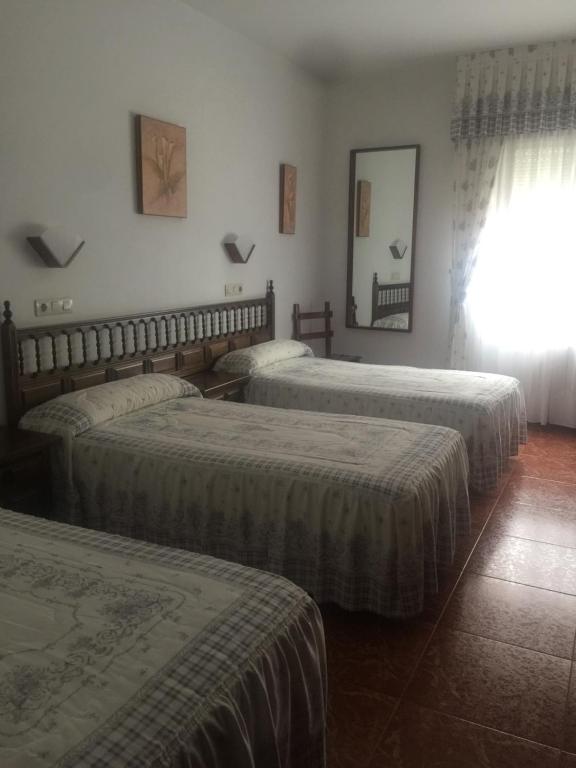 Katil atau katil-katil dalam bilik di HOTEL O NOSO BAR