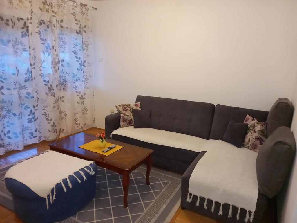a living room with a couch and a table at Apartman Ana in Trebinje